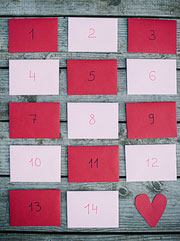 Pink and red envelopes from Paper Source with Valentine's Day countdown calendar