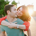 A couple laughing and playing together. Beautiful sunset light in the background. Stanford University engagement photos.